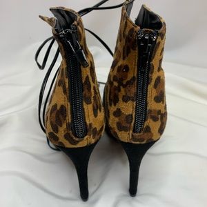 Tie up leopard print booties. Pristine condition